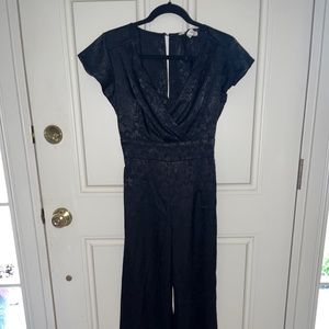 Pantsuit from Francesca’s size XS. Black with a floral pattern, unworn
